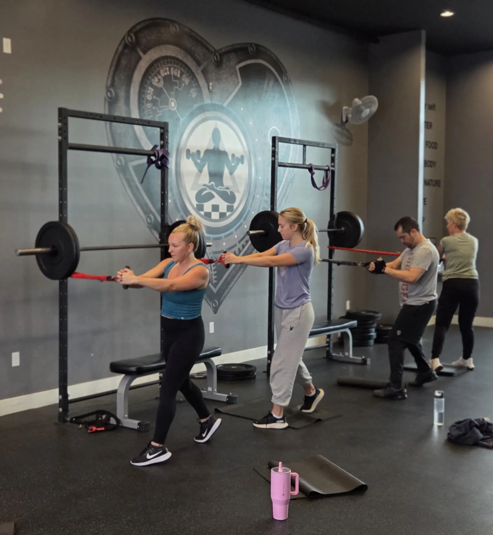 Group fitness class training with resistance bands at Fit Factory in Draper